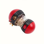 Jouet distributeur de friandises rouge pour chien avec réservoir transparent
