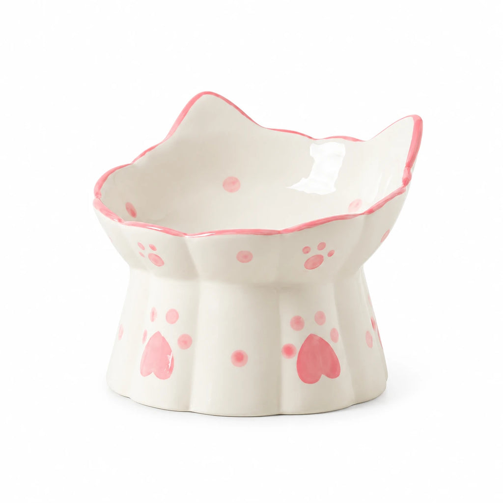 Gamelle sur pied en céramique ivoire à motifs roses, seule sur fond blanc
