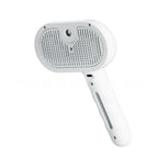 Brosse à brume blanche pour chien et chat, vue des picots sur fond blanc